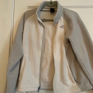 Grey and white north face jacket